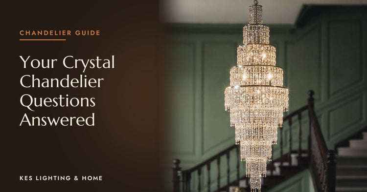 Tall tiered chandelier with clear drops in a stairwell with green panelling