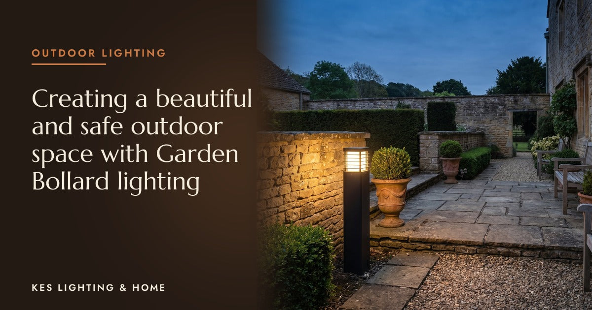 Black outdoor bollard lighting a stone garden path at dusk