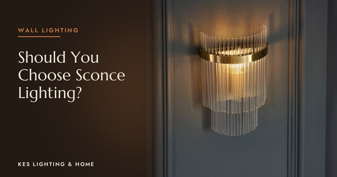 Gold-tone and clear rod wall light glowing on dark panelling