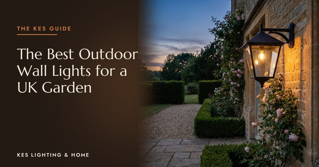 Black outdoor wall lantern lit on a stone cottage at dusk