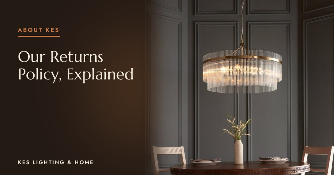 Clear rod chandelier with a gold-tone ring above a round dining table against dark panelling