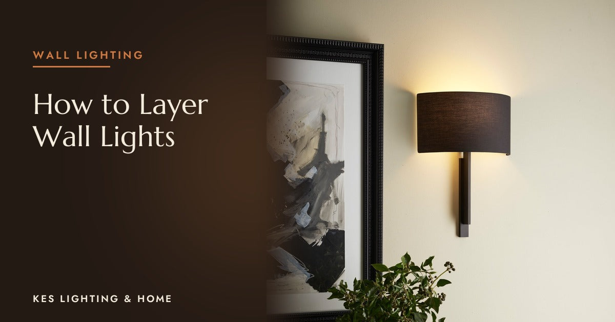Wall light with a curved shade beside a framed picture