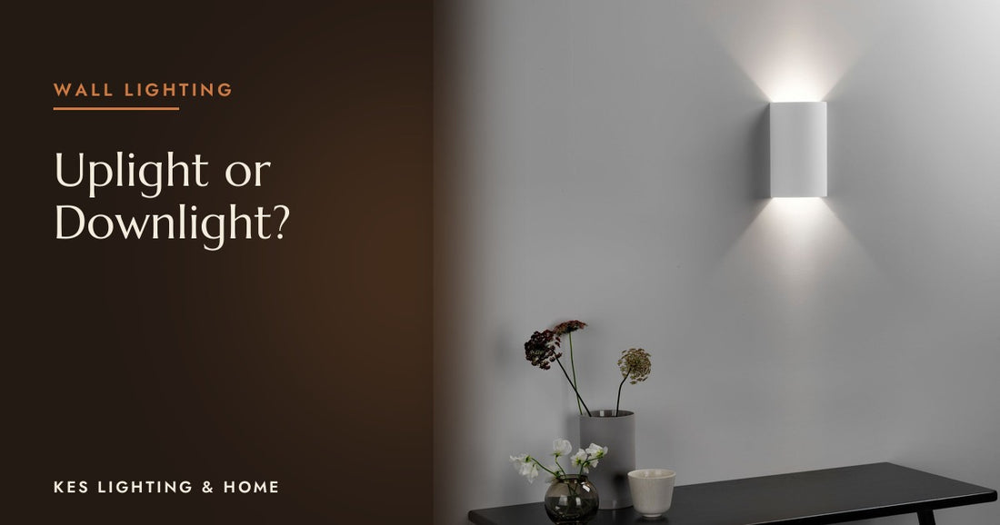 White up-and-down wall light above a black console table