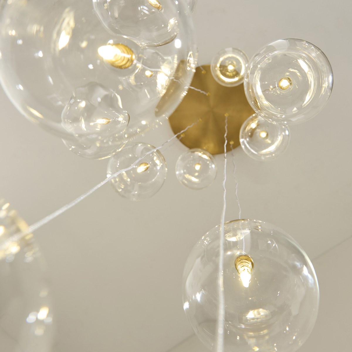 Endon Oslo 12 Light Cascade Pendant Light in Brushed Aged Brass with Clear Glass