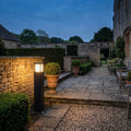 Norlys Halmstad Outdoor Bollard in Black shown lit in a custom space