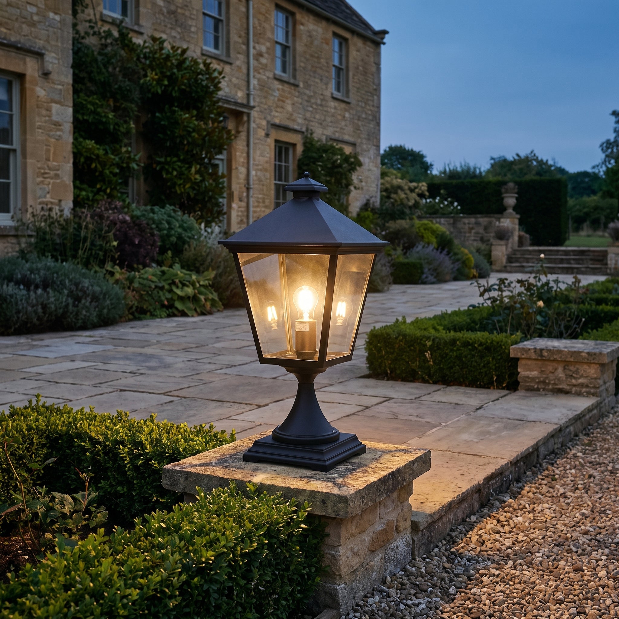 Norlys Turin Grande Outdoor Pedestal in Black Aluminium Polycarbonate shown lit in a custom space