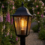 ST64 Vintage Spiral Filament LED Lamp 7W ES / E27 Cap Dimmable Extra Warm White 1800K - fitted in an outdoor lantern