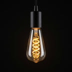ST64 Vintage Spiral Filament LED Lamp 7W ES / E27 Cap Dimmable Extra Warm White 1800K - lit, showing the 1800K amber glow
