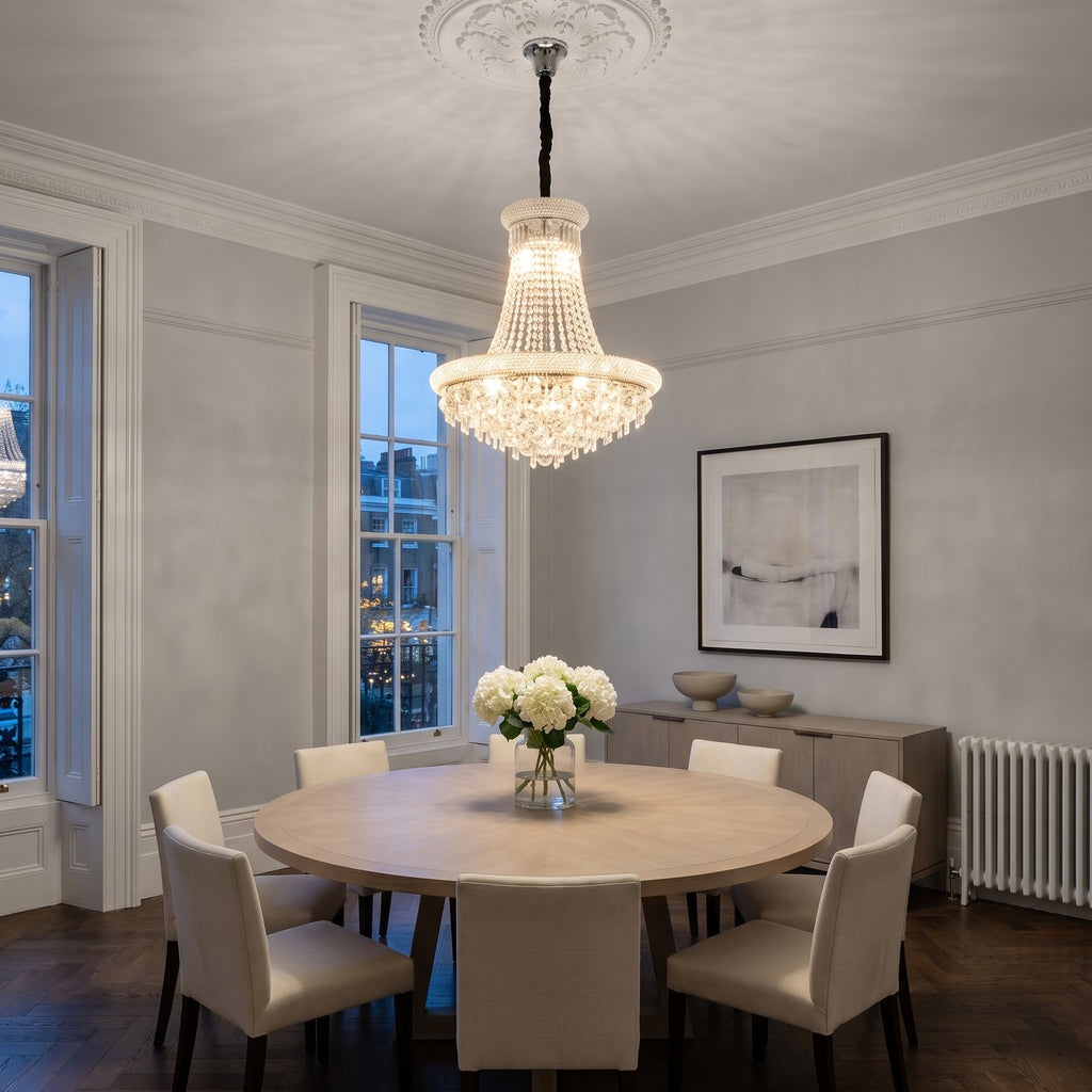 Diyas Alexandra 13 Light Pendant in Polished Chrome with Crystal lit over a dining table in an Edwardian mansion flat