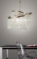 Diyas Cortina 8 Light Telescopic Pendant Light in Antique Brass with Crystal
