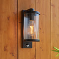 Endon Newcombe Outdoor Wall Light in Matt Black and Clear Ribbed Glass