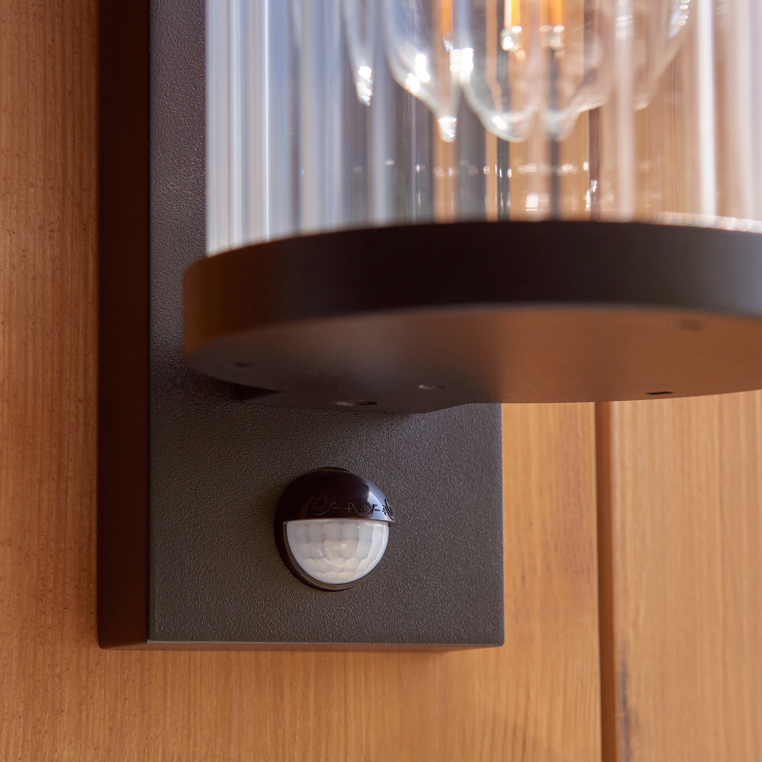 Endon Newcombe Outdoor Wall Light in Matt Black and Clear Ribbed Glass