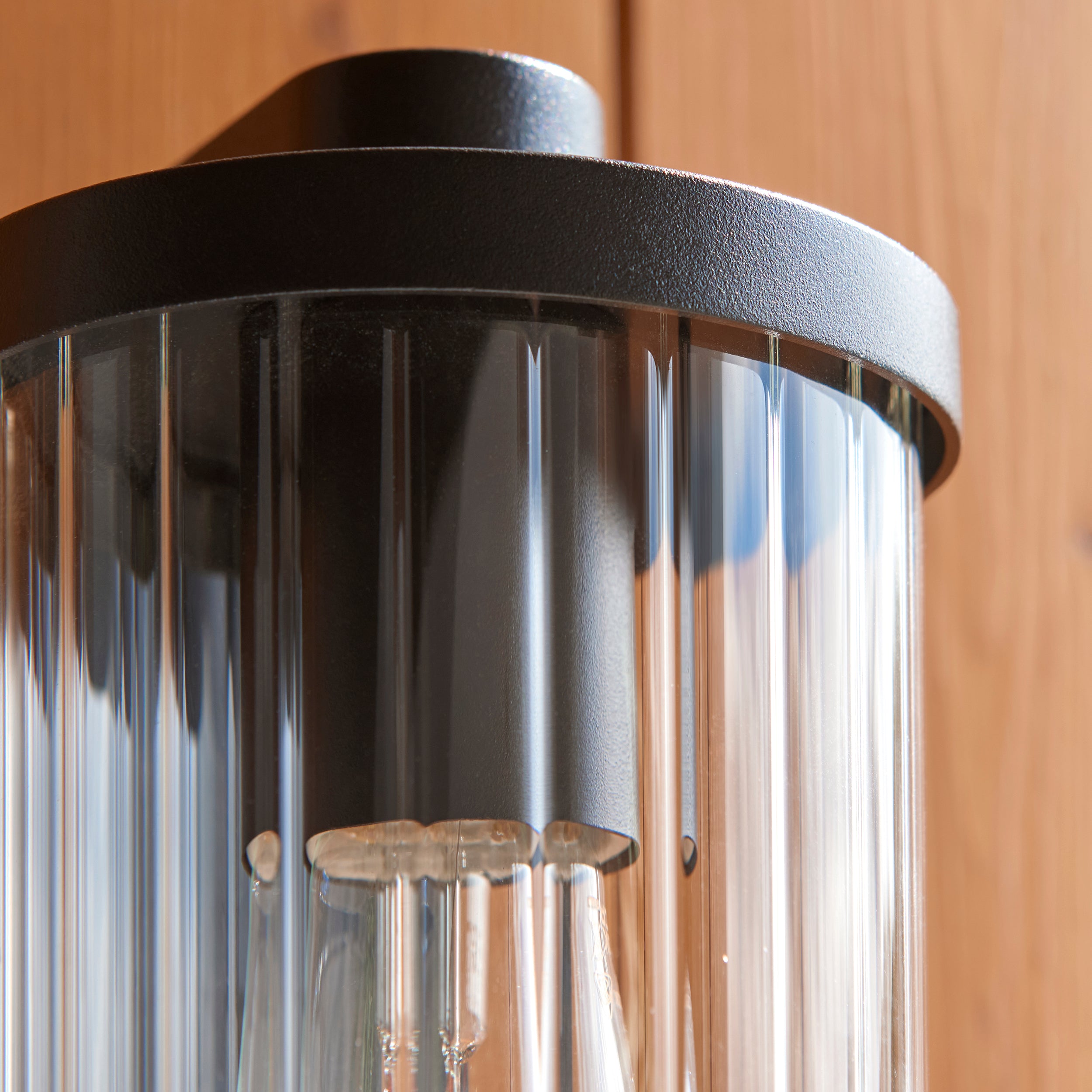 Endon Newcombe Outdoor Wall Light in Matt Black and Clear Ribbed Glass