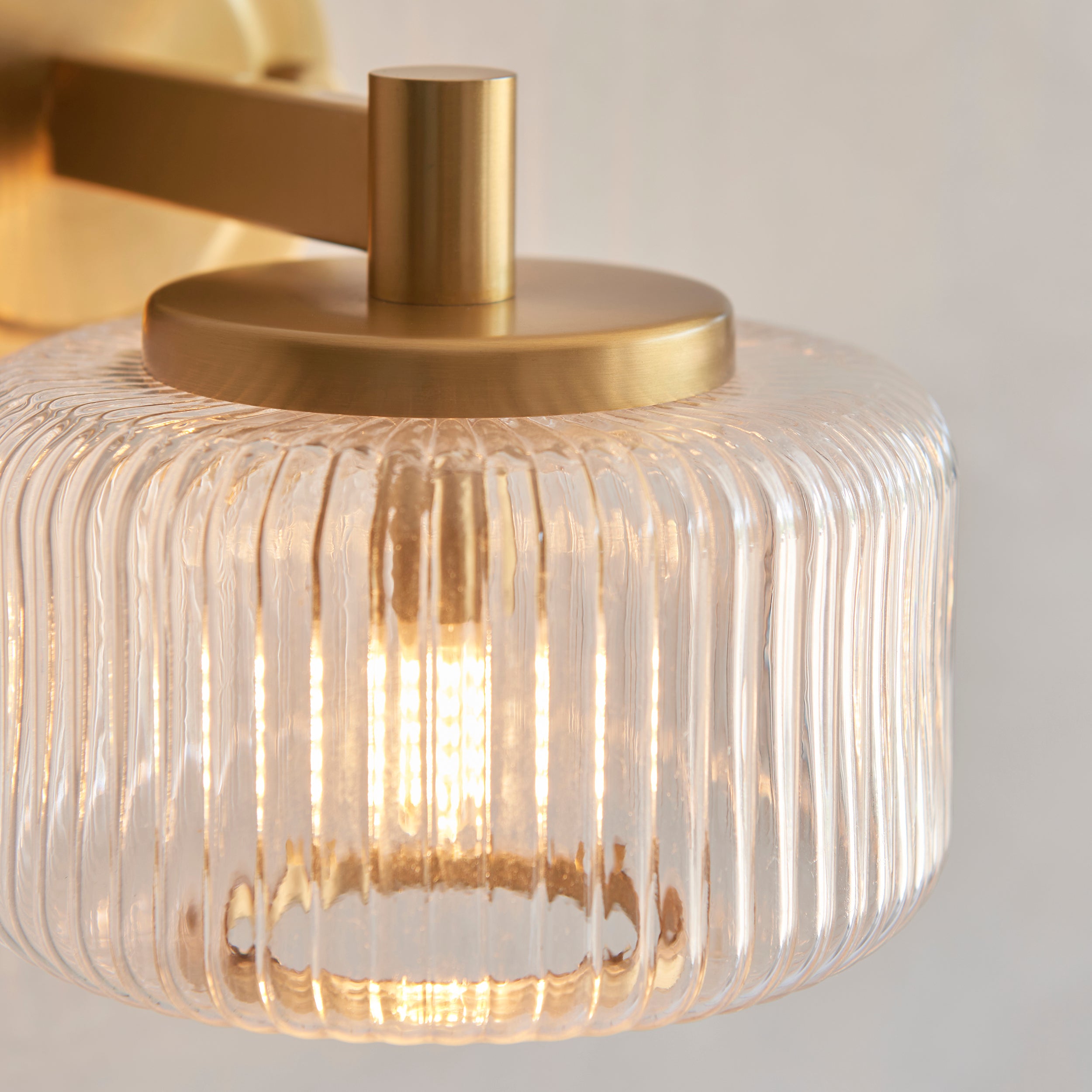 Endon Stamford Wall Light in Brushed Aged Brass and Clear Ribbed Glass
