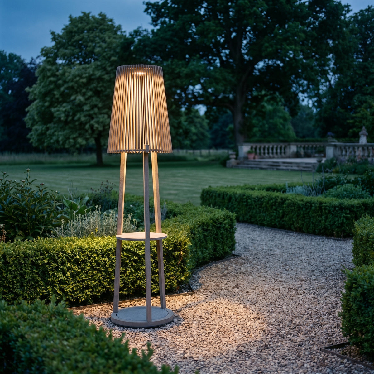 Tecka 500lm Solar Lamppost - Teak Duratek H 182 cm, lit, in a styled room. Editorial image for the Solar Post Lights collection.
