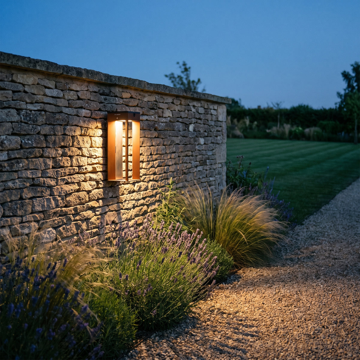 Blade 500lm Solar Wall Light 45 cm - Corten Aluminium, lit, in a styled room. Editorial image for the Solar Wall Lights collection.
