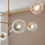 Novena Andarela 6 Light Pendant Brushed Aged Brass with Twisted Clear Glass