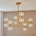 Novena Andarela12 Light Pendant Brushed Aged Brass with Twisted Clear Glass