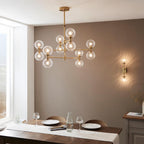 Novena Andarela12 Light Pendant Brushed Aged Brass with Twisted Clear Glass