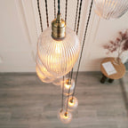 Novena Lavaur 13 Light Cascade Pendant in Antique Brass with Clear Ribbed Glass Shades