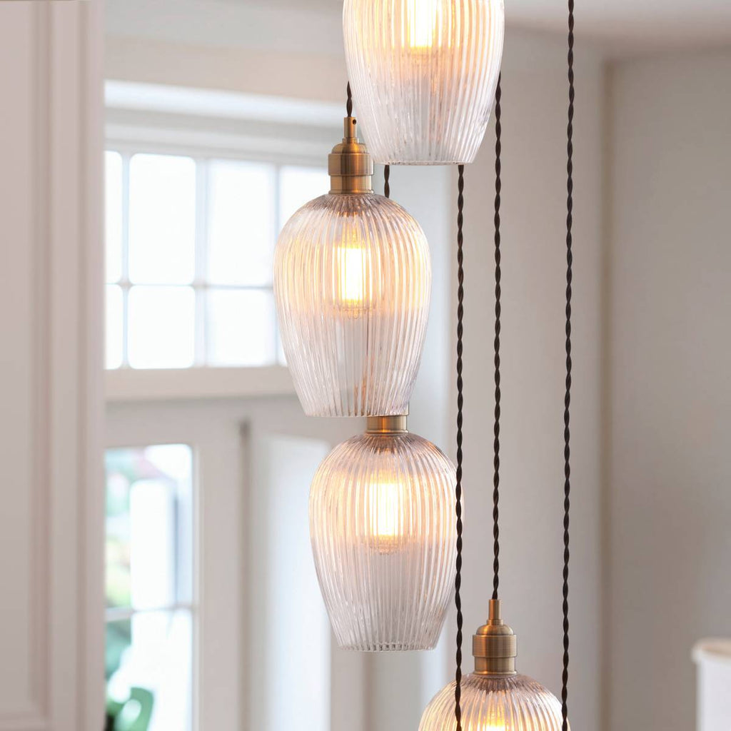 Novena Lavaur 13 Light Cascade Pendant in Antique Brass with Clear Ribbed Glass Shades