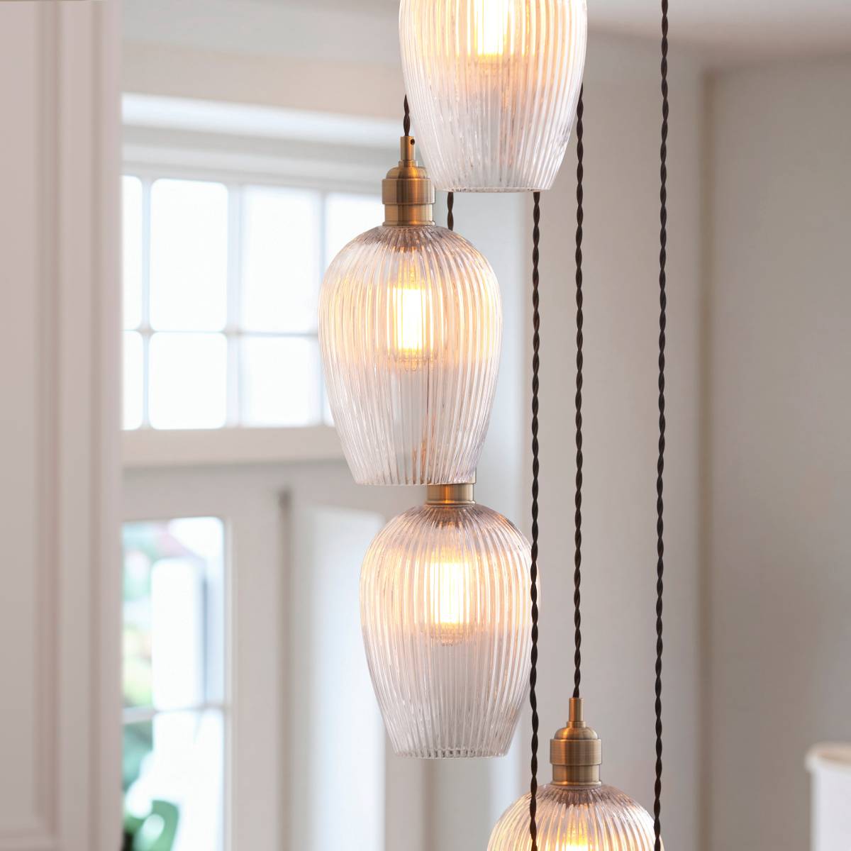 Novena Lavaur 13 Light Cascade Pendant in Antique Brass with Clear Ribbed Glass Shades