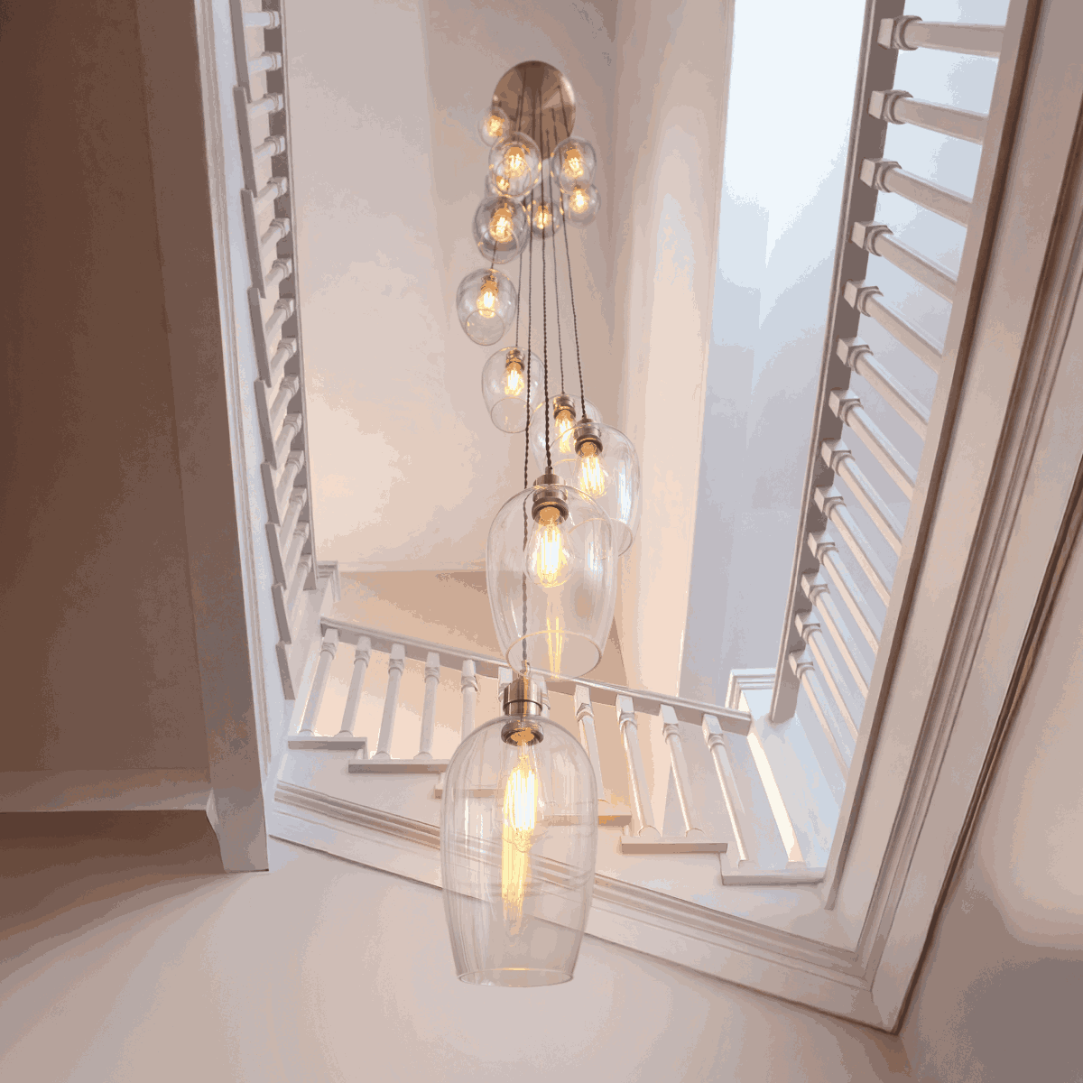 Novena Lavaur 13 Light Cascade Pendant Light in Antique Brass with Clear Glass Shades