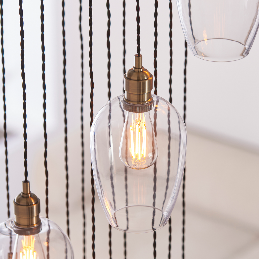 Novena Lavaur 13 Light Cascade Pendant Light in Antique Brass with Clear Glass Shades