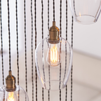 Novena Lavaur 13 Light Cascade Pendant Light in Antique Brass with Clear Glass Shades
