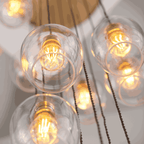Novena Lavaur 13 Light Cascade Pendant Light in Antique Brass with Clear Glass Shades