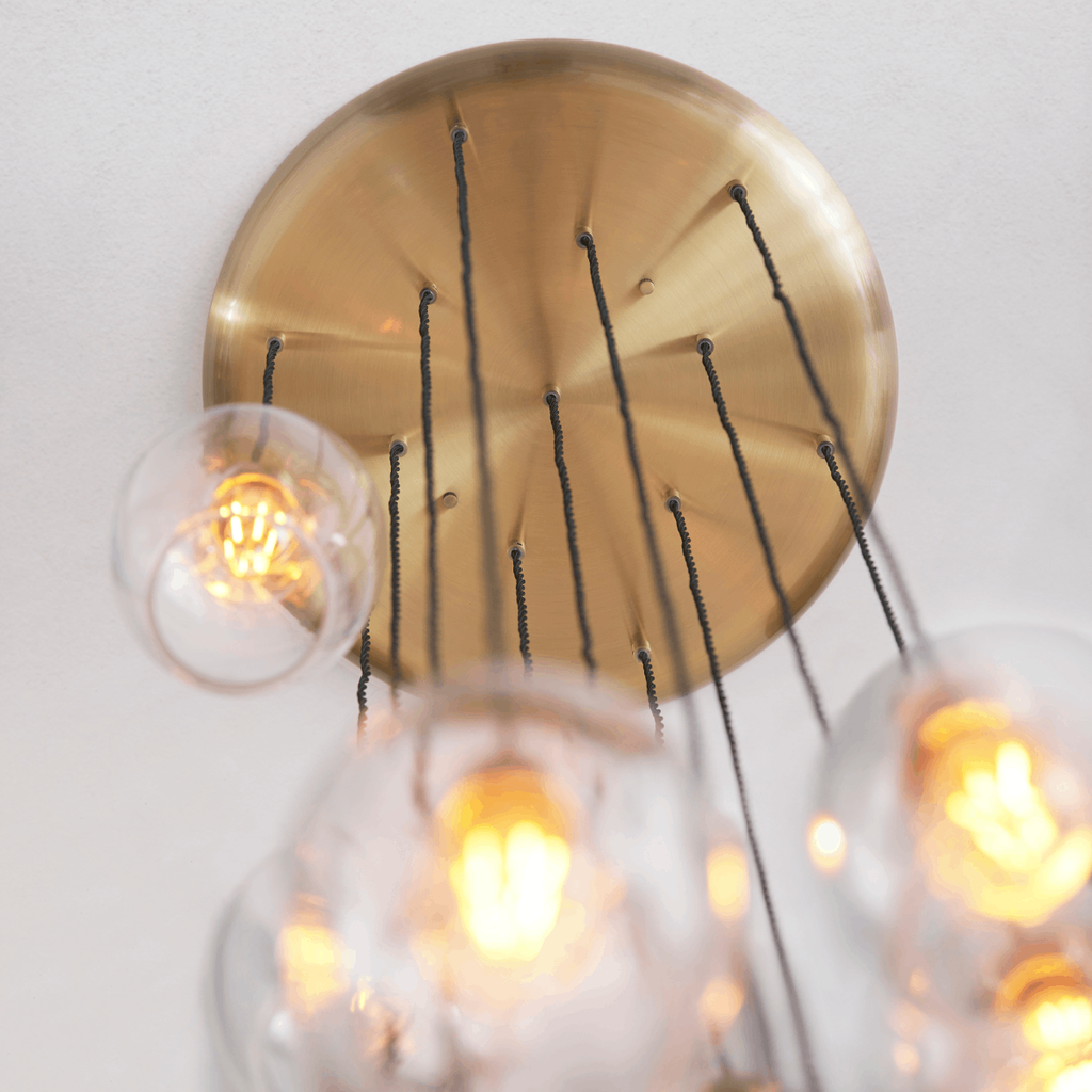 Novena Lavaur 13 Light Cascade Pendant Light in Antique Brass with Clear Glass Shades