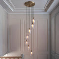 Novena Lavaur 7 Light Cascade Pendant in Antique Brass with Clear Glass Shades