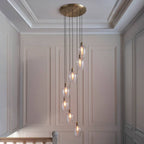 Novena Lavaur 7 Light Cascade Pendant in Antique Brass with Clear Glass Shades