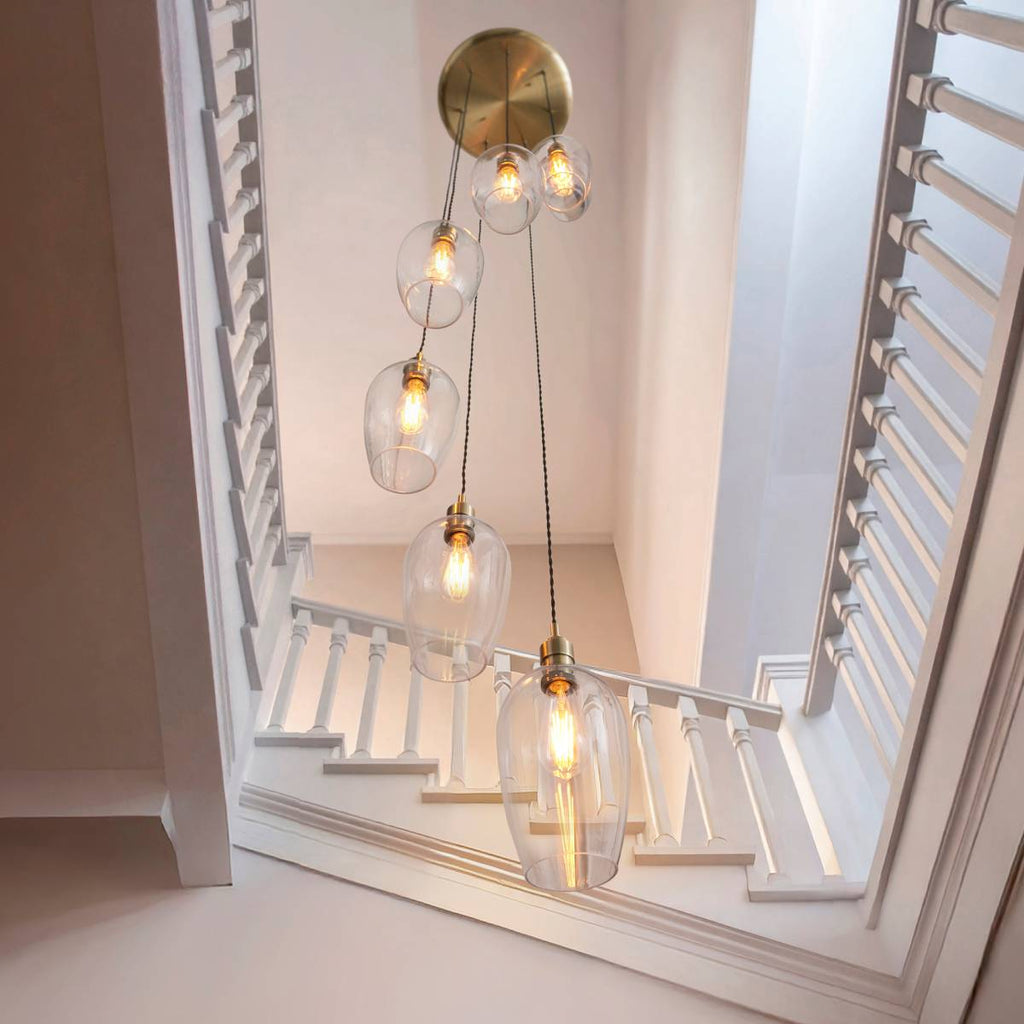 Novena Lavaur 7 Light Cascade Pendant in Antique Brass with Clear Glass Shades