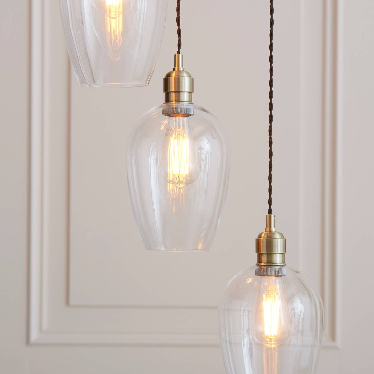 Novena Lavaur 7 Light Cascade Pendant in Antique Brass with Clear Glass Shades
