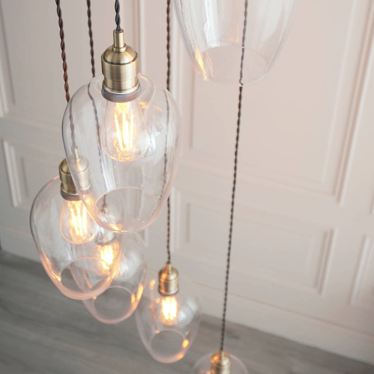 Novena Lavaur 7 Light Cascade Pendant in Antique Brass with Clear Glass Shades