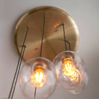 Novena Lavaur 7 Light Cascade Pendant in Antique Brass with Clear Glass Shades