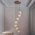 Novena Lavaur 7 Light Cascade Pendant in Antique Brass with Clear Ribbed Glass Shades
