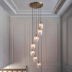 Novena Lavaur 7 Light Cascade Pendant in Antique Brass with Clear Ribbed Glass Shades