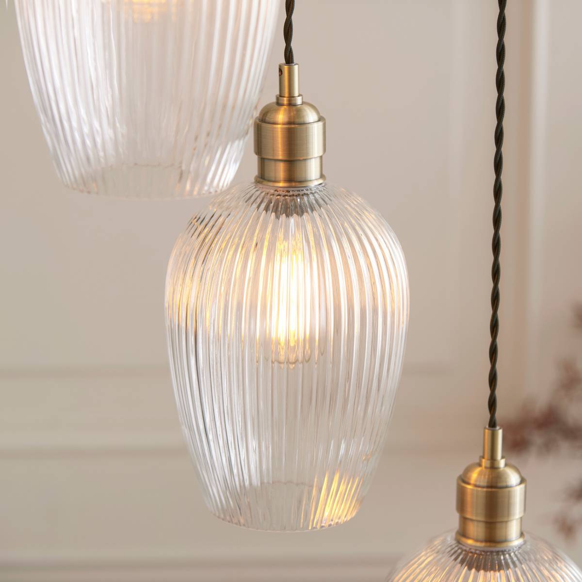 Novena Lavaur 7 Light Cascade Pendant in Antique Brass with Clear Ribbed Glass Shades