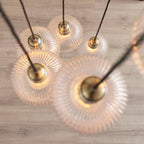 Novena Lavaur 7 Light Cascade Pendant in Antique Brass with Clear Ribbed Glass Shades