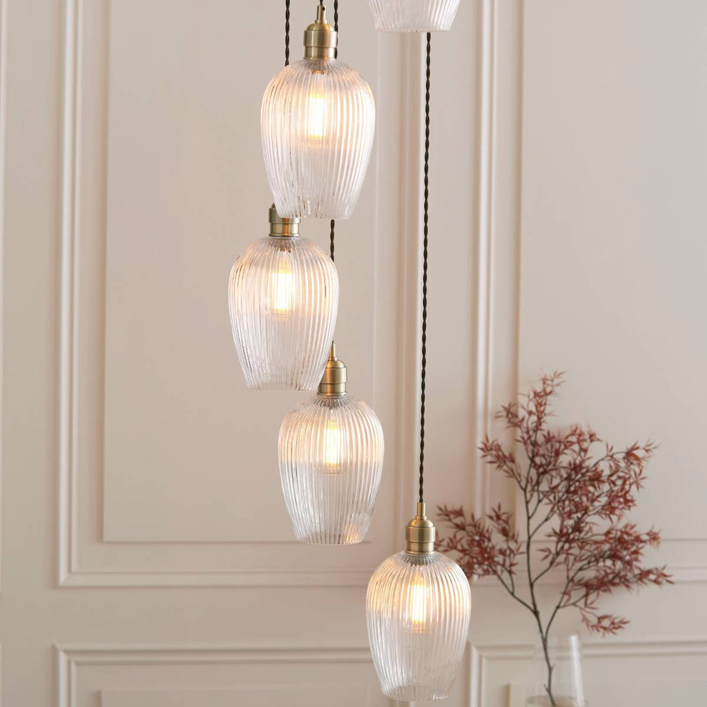 Novena Lavaur 7 Light Cascade Pendant in Antique Brass with Clear Ribbed Glass Shades