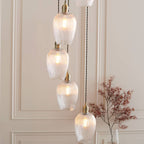 Novena Lavaur 7 Light Cascade Pendant in Antique Brass with Clear Ribbed Glass Shades