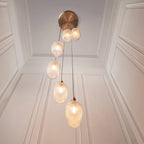 Novena Lavaur 7 Light Cascade Pendant in Antique Brass with Clear Ribbed Glass Shades