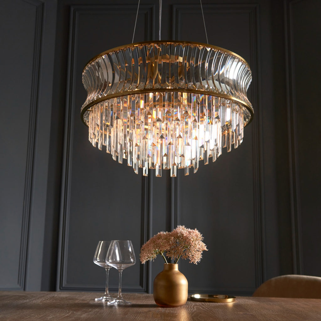 Novena Nava 9 Light Pendant Light with Crystal and Clear Glass in Warm Brass Plate