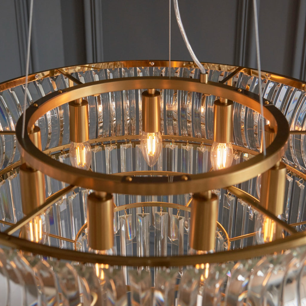 Novena Nava 9 Light Pendant Light with Crystal and Clear Glass in Warm Brass Plate