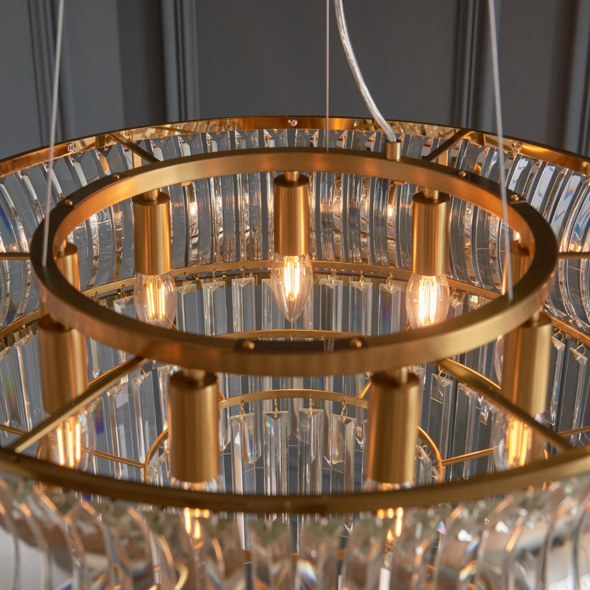 Novena Nava 9 Light Pendant Light with Crystal and Clear Glass in Warm Brass Plate