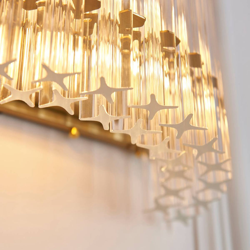 Novena Pourtel 2 Light Wall Light in Brushed Aged Brass with Clear Glass Shade