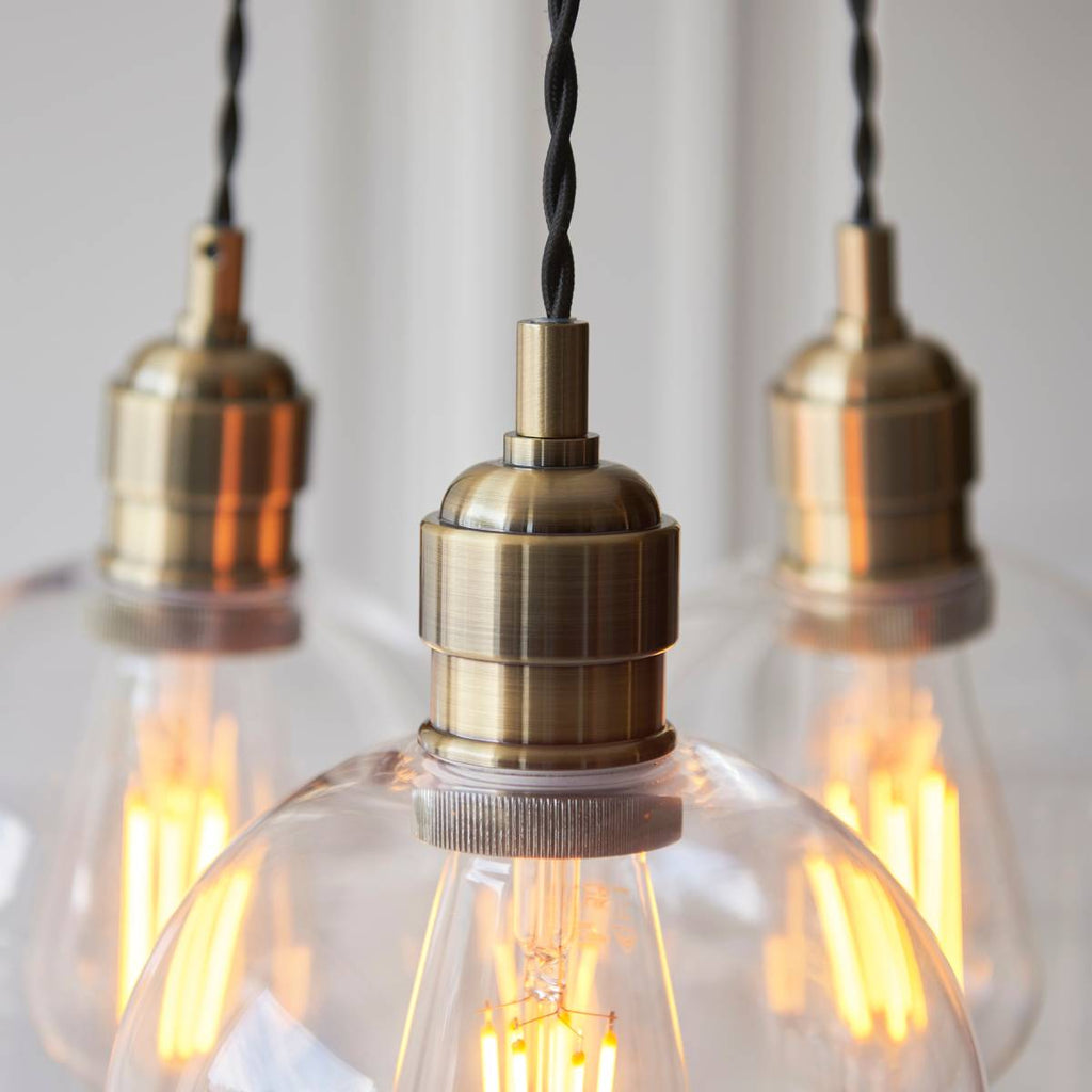 Novena Tarn 3 Light Cluster Pendant in Antique Brass with Clear Glass Shades
