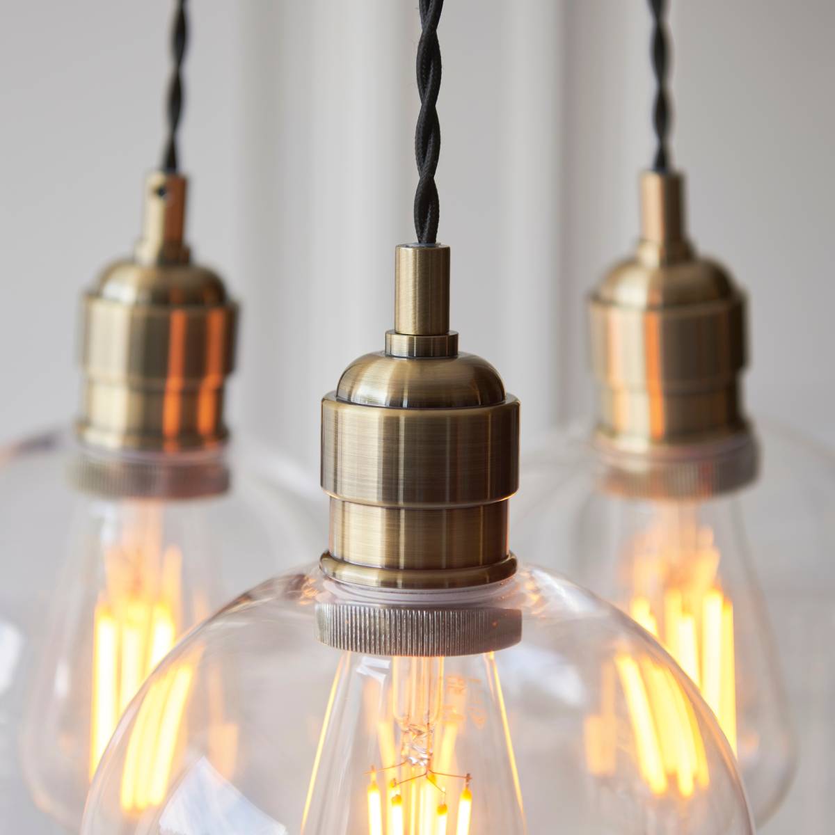 Novena Tarn 3 Light Cluster Pendant in Antique Brass with Clear Glass Shades